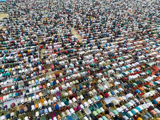 Aerial view of a large gathering of people in prayer during Eid al-Fitr, Sher-e-Bangla Nagar, Dhaka, Bangladesh.