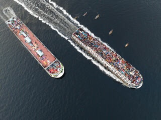 Aerial view of busy ships and vessels navigating through water during Eid al-Fitr celebrations, Subhadya, Keraniganj, Dhaka, Bangladesh.