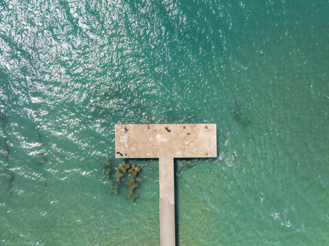 Aerial view of a beautiful pier by the tranquil Mediterranean Sea, Capaccio Paestum, Campania, Italy.