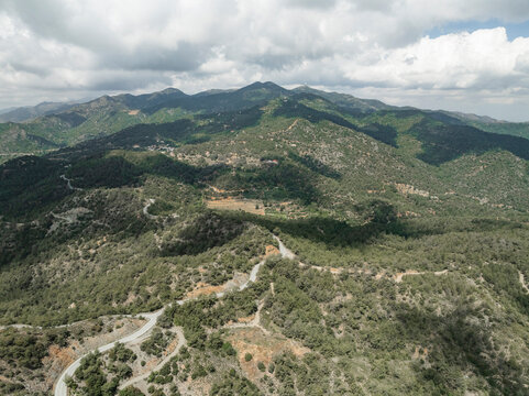 Aerial view of the beautiful Holy Monastery of Panagia Machaira surrounded by lush forests and rugged mountains, Troodos Mountains, Lazanias, Nicosia, Cyprus.