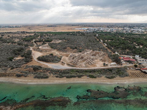Aerial view of ancient ruins of Salamis along the tranquil coastline with beautiful sea and sandy shore, Agios Sergios, Famagusta, Turkish Republic of Northern Cyprus.