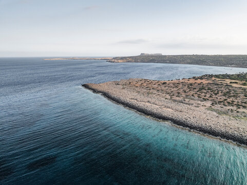 Aerial view of beautiful rocky coastline and tranquil blue sea, Cyclops Cave, Paralimni, Famagusta, Cyprus.