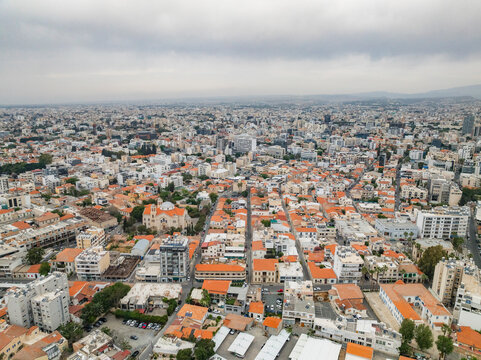 Aerial view of beautiful urban landscape with dense buildings and orange roofs, Limassol, Limassol, Cyprus.
