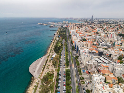 Aerial view of beautiful coastal cityscape with modern buildings and blue water, Limassol, Limassol, Cyprus.