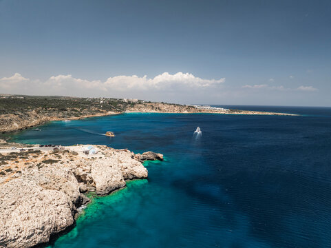 Aerial view of beautiful Blue Lagoon with clear turquoise water and scenic cliffs, Cape Greco Peninsula, Agia Napa, Famagusta, Cyprus.