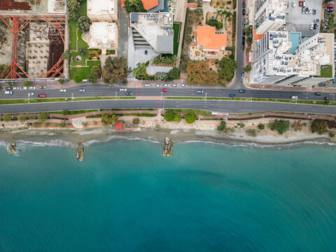 Aerial view of beautiful coastal beach and cityscape with modern buildings and blue water, Limassol, Limassol, Cyprus.