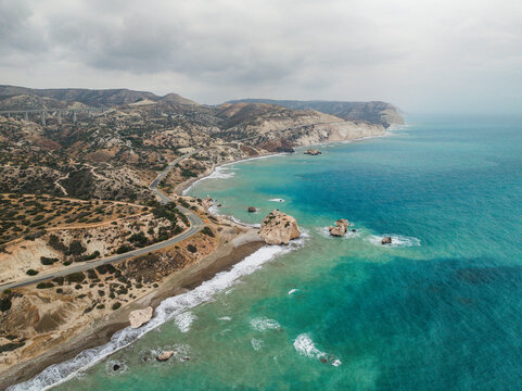 Aerial view of Aphrodite Beach with beautiful rock formations and serene waves, Kouklia, Paphos, Cyprus.