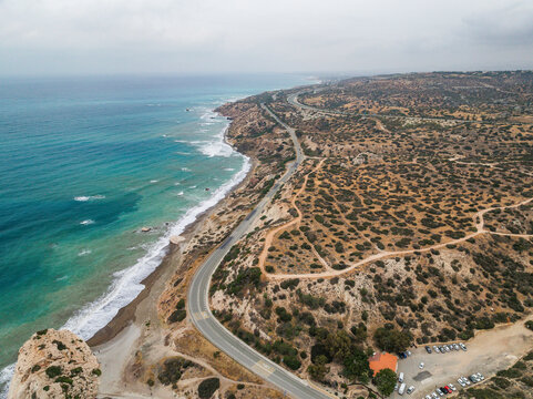 Aerial view of beautiful Aphrodite Beach with serene waves and scenic cliffs, Kouklia, Paphos, Cyprus.