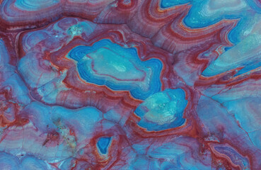 Aerial view of colorful and intricate geological formations with vibrant patterns, Hanksville, Utah, United States.