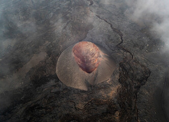 Aerial view of the rugged volcanic landscape with dramatic craters and lava formations, Timanfaya National Park, Yaiza, Canary Islands, Spain.