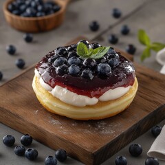 Delicious blueberry donut sitting on a wooden board with scattered blueberries studio shot close up dessert