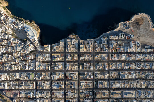 Aerial view of beautiful historic buildings and coastline in Polignano a Mare, Bari, Italy.