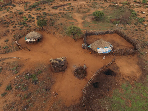 Aerial view of traditional hamar tribe village with thatched roof huts in a rural landscape, Southern Nations Nationalities and Peoples' Region, Ethiopia.
