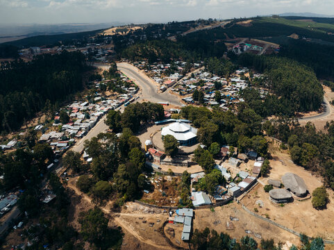 Aerial view of entoto maryam church surrounded by a scenic village and lush greenery, Addis Ababa, Ethiopia.