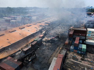 Sitakunda, Bangladesh - 05 June 2022: Aerial view of the burnt and damaged BM Container Depot with smoke plumes, Sitakunda, Bangladesh.