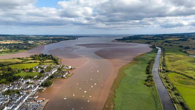 Aerial view of River Exe with boats and a sandbank, Topsham, United Kingdom.