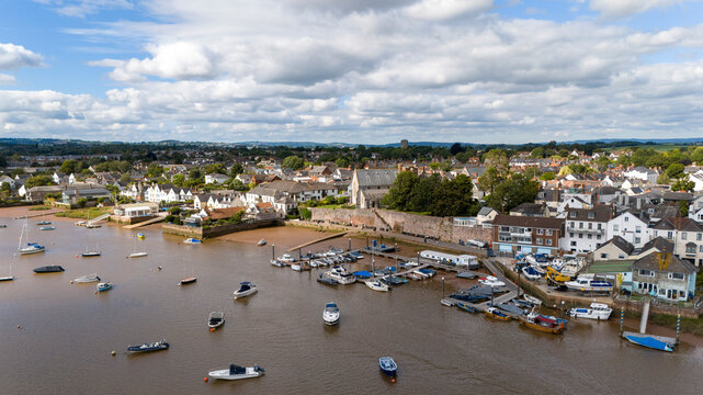 Aerial view of the beautiful River Exe with boats and charming houses in Topsham, England.