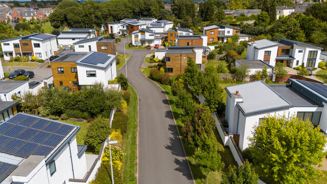 Aerial view of luxury residential development featuring solar panels and greenery, Exeter, United Kingdom.
