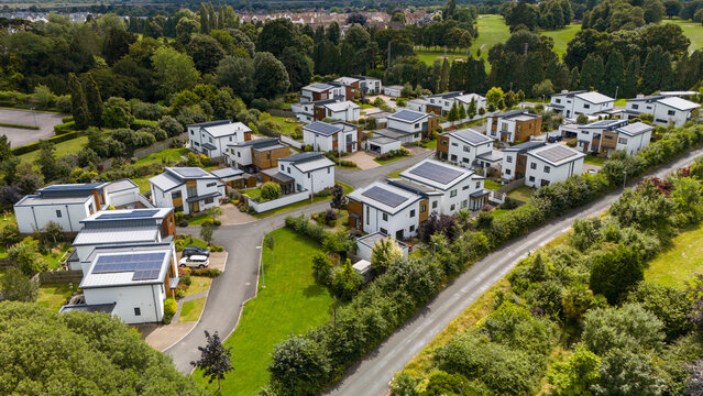 Aerial view of luxury residential development with solar panels and green roofs, Exeter, United Kingdom.
