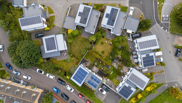 Aerial view of luxury residential development with solar panels and green roofs, Exeter, United Kingdom.
