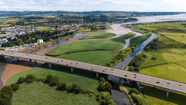 Aerial view of the picturesque M5 bridge over the scenic River Exe with beautiful greenery and fields, Topsham, England.