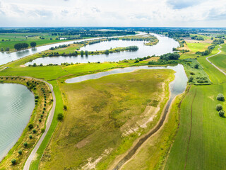 Aerial view of floodplains along river Nederrijn with nature development area Lunenburgerwaard and recreational area Gravenbol, Amerongen, Utrecht, Netherlands.