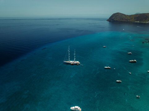Aerial view of boats along the coast, Lipari island, Aeolian Islands archipelagos, Sicily, Italy.