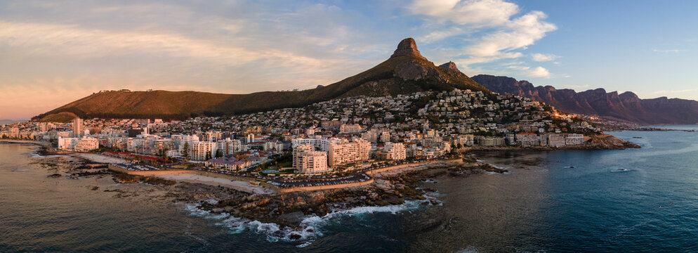 Panoramic aerial view of Atlantic Seaboard sunset with Lion&rsquo;s Head Mountain, Bantry Bay and Sea Point from Atlantic Ocean, Cape Town, South Africa.