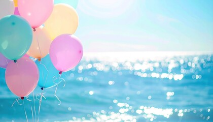 Pastel balloons float against a bright, sparkling ocean background