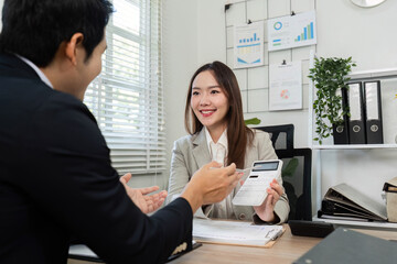Positive Financial Consultation. Smiling financial advisor presenting financial solutions to a client.