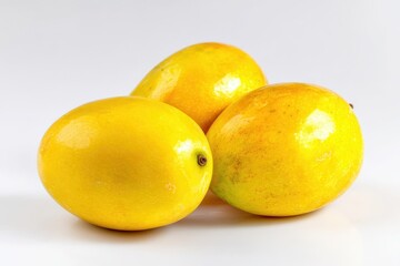Fresh sweet mangoes isolated on white, captured with professional lighting for clean commercial presentation