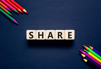 Share symbol. Concept word Share on beautiful wooden blocks. Beautiful black table black...