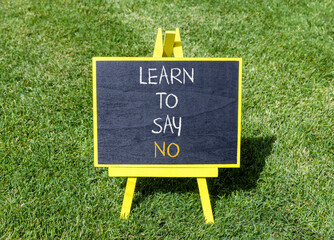 Learn to say no symbol. Concept words phrase Learn to say no on beautiful black blackboard....