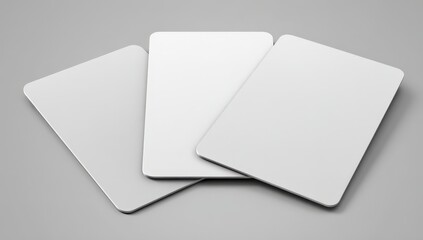 Three blank white cards on gray background.