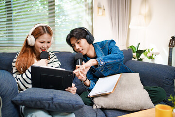 Online podcast planning with young man and woman using tablet and microphones