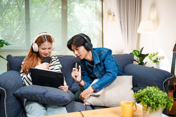 Online podcast planning with young man and woman using tablet and microphones