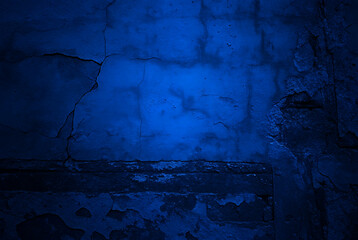 Toned rough concrete surface with Black dark navy blue texture for design, painted building with cracks