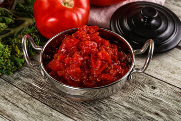 Diced ripe tomato with sauce