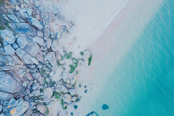 drone shot of a pristine coastline with clear turquoise water. Drone zenithal view, summer background concept