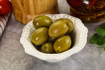Big green marinated olives in the bowl