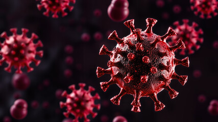 Close-up of red virus cells floating on dark background