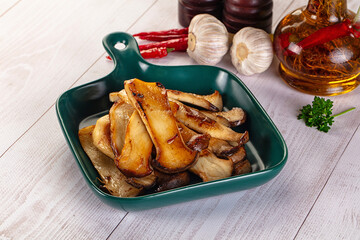 Roasted eringi mushrooms in the plate