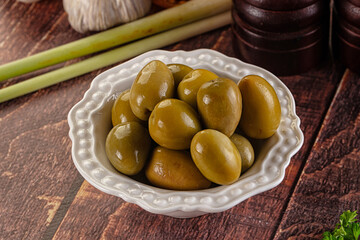 Greek green olives marinated in the bowl