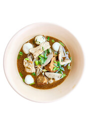 Delicious bowl of savory noodle soup with meat and herbs