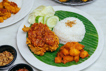 indonesian ayam geprek with sambal and chili potato 