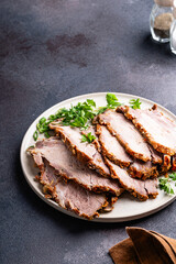 Pork roast, slices of meat in plate