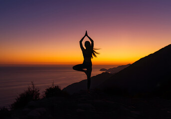 Woman Silhouette Yoga Pose at Sunset Clifftop