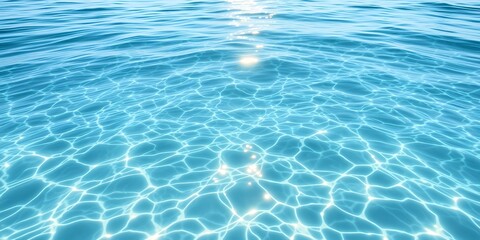 Obraz premium A view of crystal clear turquoise water with sunlight reflecting and creating patterns on the surface