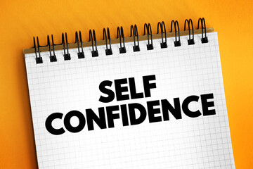 Self Confidence is an attitude about your skills and abilities, text concept on notepad