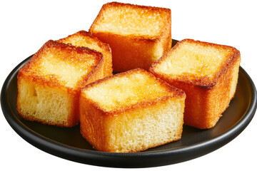Golden toast cubes on a black plate glistening and inviting